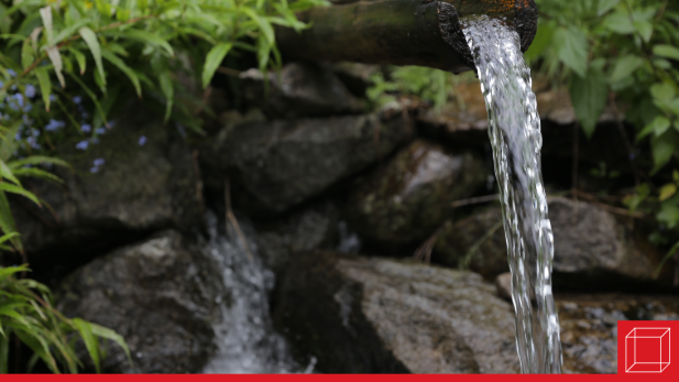 Water flowing out of a spout