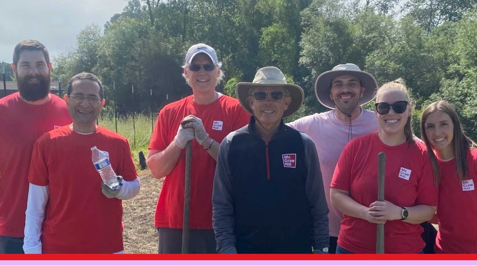 McGraw Hill employees volunteering at an outdoor community garden