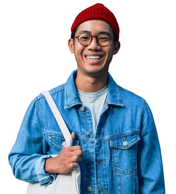 Smiling person wearing a knit hat and glasses.