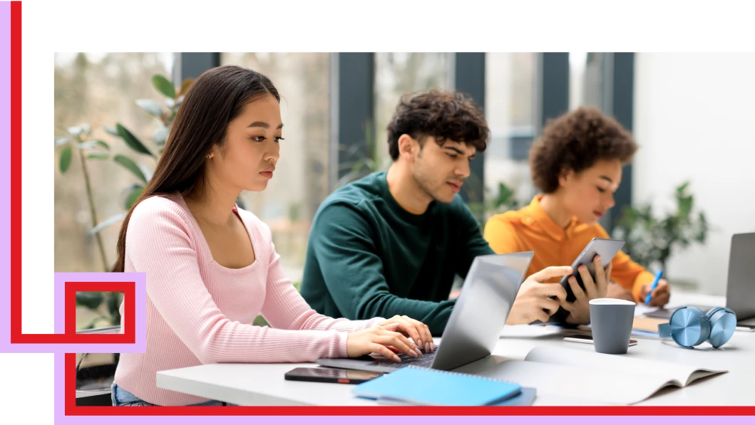 Students studying using a computer, tablet and a pen.