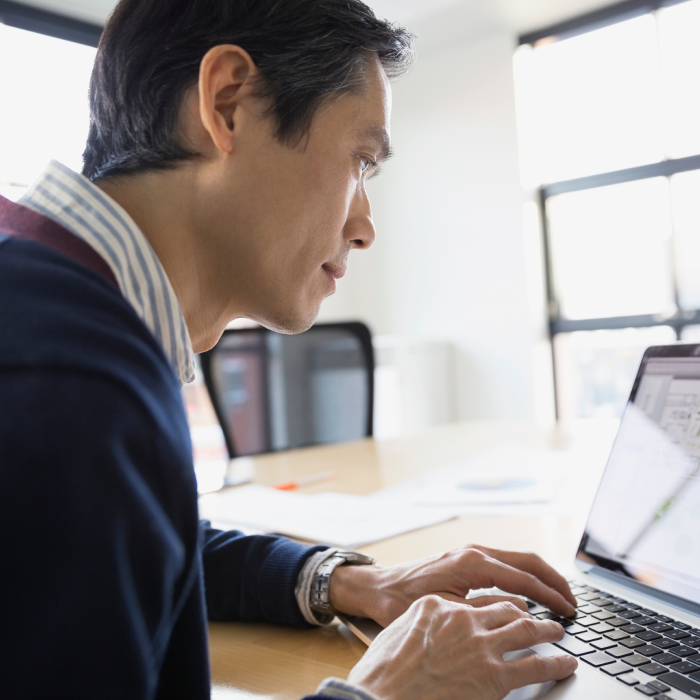 man in office on laptop computer