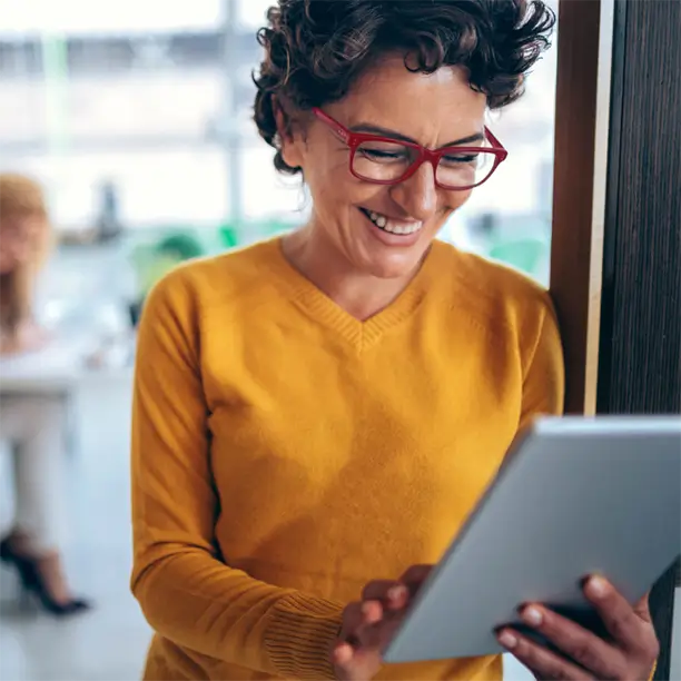 woman in office using tablet