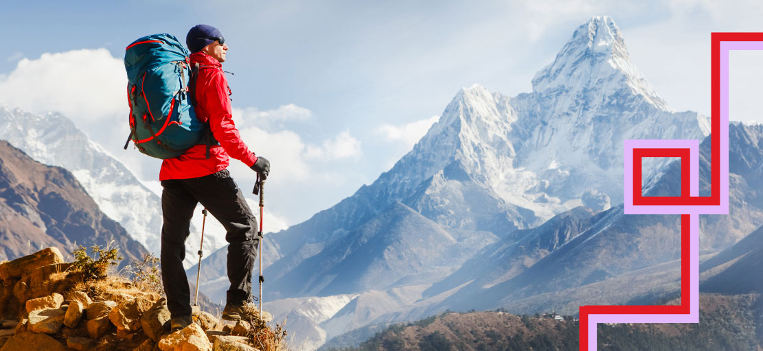 Hiker staring at mountains.