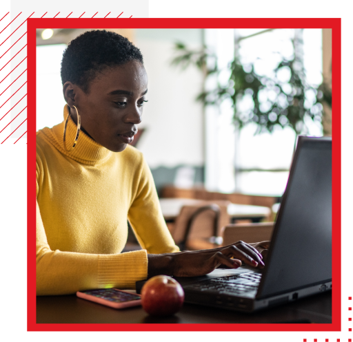 Woman at desk with open laptop