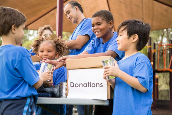 Group of elementary students seeking donations