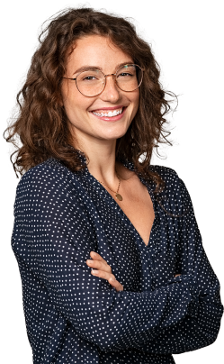 Smiling person wearing glasses.